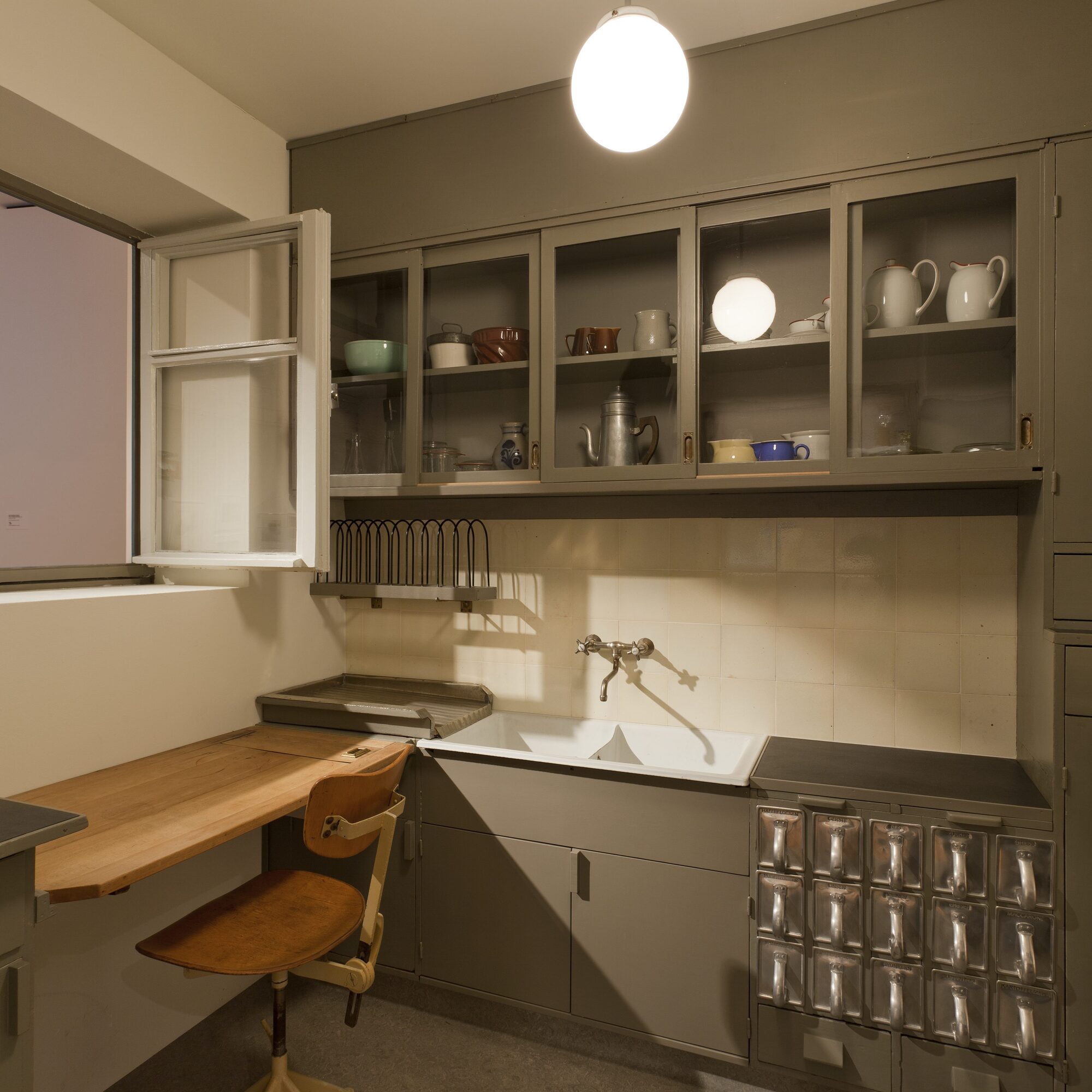 Margarete Schütte-Lihotzky (Austrian, 1897–2000). Frankfurt Kitchen from the Ginnheim- Höhenblick Housing Estate, Frankfurt-am-Main, Germany, 1926–27. Installation view of Counter Space: Design and the Modern Kitchen. The Museum of Modern Art, New York, September 15, 2010–May 2, 2011. 8'9" x 12'10" x 6'10" (266.7 x 391.2 x 208.3 cm). The Museum of Modern Art, New York. Gift of Joan R. Brewster in memory of her husband George W. W. Brewster, by exchange and the Architecture & Design Purchase Fund, 2009. Photograph by Jonathan Muzikar
