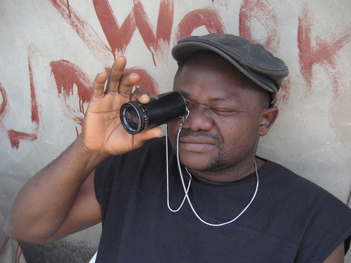<i>Nollywood Babylon.</i> 2008. Canada/Nigeria. Written, directed, and photographed by Ben Addelman, Samir Mallal. Pictured: Lancelot prepares to take a shot. Photo credit: Samir Mallal. &copy; 2008 National Film Board of Canada. All rights reserved