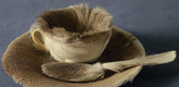 Meret Oppenheim. <i>Object.</i> 1936. Fur-covered cup, saucer, and spoon, cup 4 3/8" (10.9 cm) in diameter; saucer 9 3/8" (23.7 cm) in diameter; spoon 8" (20.2 cm) long, overall height 2 7/8" (7.3 cm). Purchase. &copy; 2009 Artists Rights Society (ARS), New York/Pro Litteris, Zurich