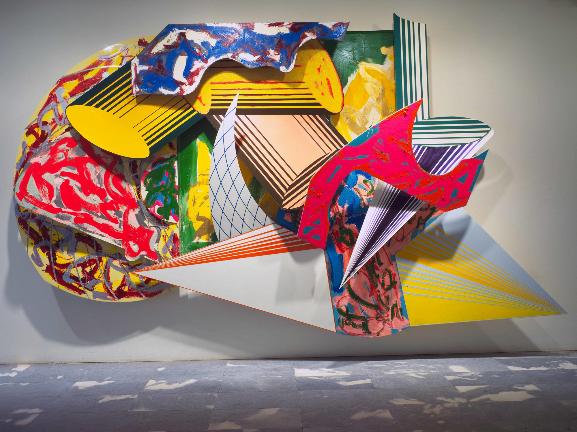 Frank Stella. <em>GiufÃ , la luna, i ladri e le guardie.</em> 1984. Synthetic polymer paint, oil, urethane enamel, fluorescent alkyd, and printing ink on canvas, and etched magnesium, aluminum, and fiberglass. The Museum of Modern Art, New York. Acquired through the James Thrall Soby Bequest. Â© 2018 Frank Stella / Artists Rights Society (ARS), New York
