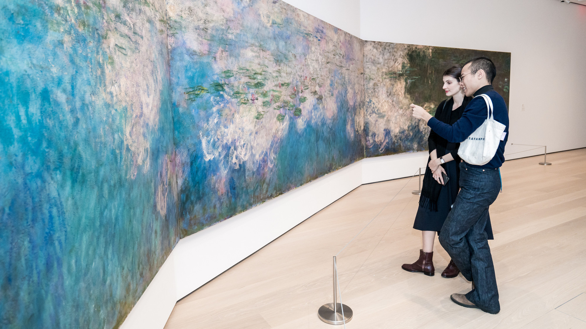 A view of the fifth-floor collection galleries. Shown: Claude Monet. Water Lilies. 1914–26. Oil on canvas, three panels. Mrs. Simon Guggenheim Fund. Photo: Austin Donohue