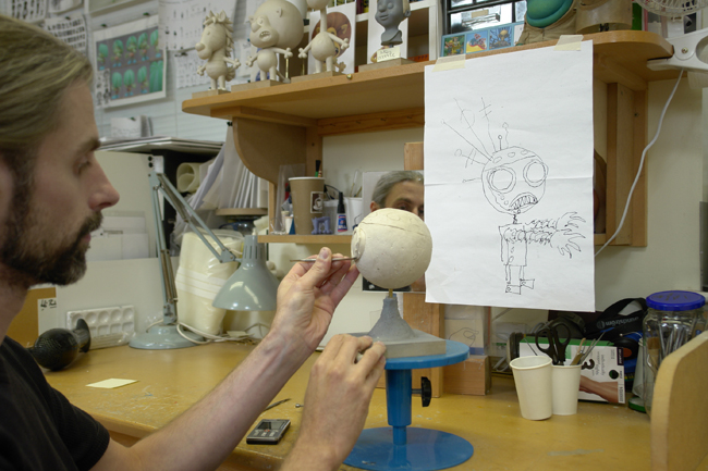 Sculptor/designer Jo Holman renders the robot in modeling clay