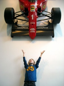 Ethan is delighted by the Formula 1 Racing Car hanging in the Education and Research building lobby.