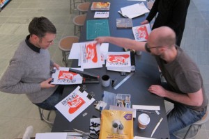 Phil Sanders and his collaborators on March 1 working on their "printervention" at Print Studio, a book of iPad drawings by artist Eddie Martinez.