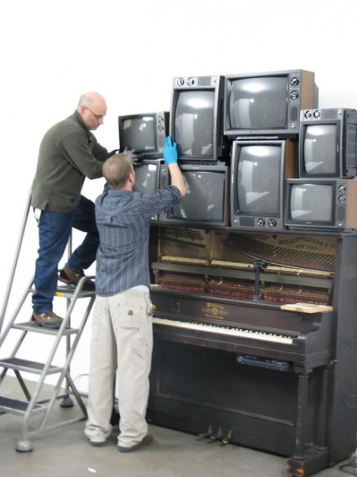 Installing the video sculpture after completing the conservation work