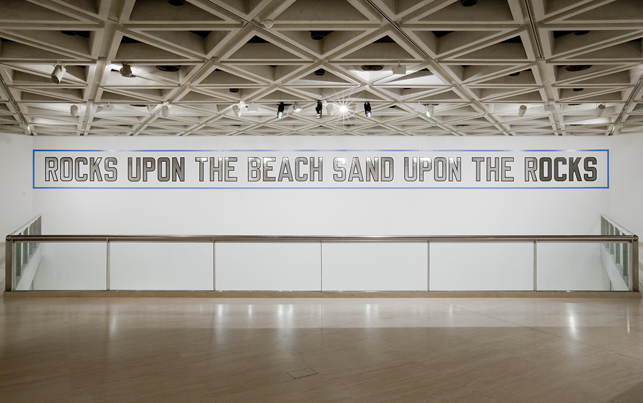 Lawrence Weiner (American, born 1942).  Rocks Upon the Beach Sand Upon the Rocks, 1988. Language + the materials referred to, dimensions variable.  Acquisition from the Werner Dannheisser Testamentary Trust.  © 2013 Lawrence Weiner / Artists Rights Society (ARS), New York.  Installation view, the Art Gallery of Western Australia, 2013
