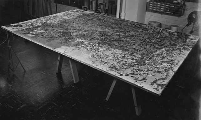 An image of Number 1A undergoing conservation treatment  in 1959. The darkness across much of the canvas is soot deposited during the fire. Here, conservators have begun to clean, working from the edges toward the center
