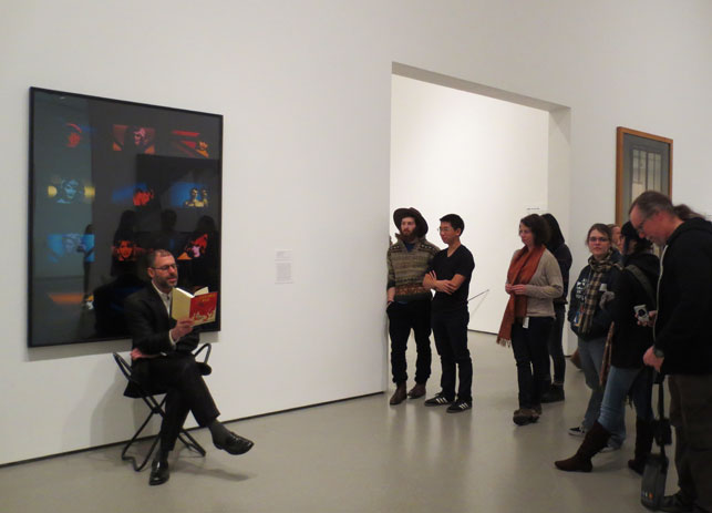 Kenneth Goldsmith performs a guerilla reading in the MoMA galleries.