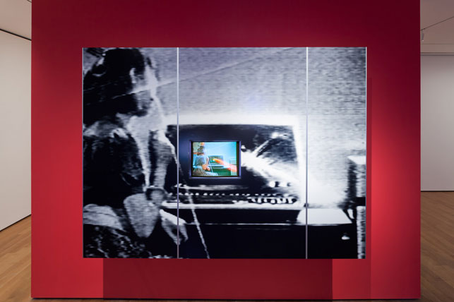 Dara Birnbaum. PM Magazine (detail). 1982. Four-channel video (color, three channels of stereo sound; 6:30 min.), two chromogenic prints, Speed Rail® structural support system, aluminum trim, one wall painted Chroma Key Blue, and one wall painted red, dimensions variable. The Museum of Modern Art, New York. Acquired with support from The Modern Women's Fund Committee, The Contemporary Arts Council of The Museum of Modern Art, and through the generosity of Ahmet Kocabiyik. © 2014 Dara Birnbaum. Courtesy the artist and Marian Goodman Gallery, New York and Paris. Installation view, Cut to Swipe, The Museum of Modern Art, October 11, 2014–March 22, 2015. Digital image © The Museum of Modern Art, New York. Photo: Jonathan Muzikar