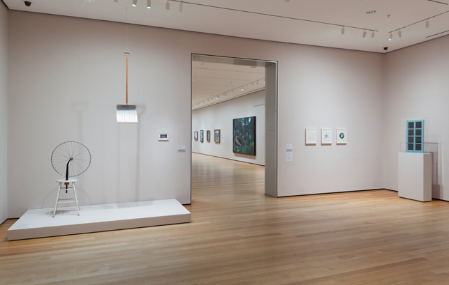 Installation view of the fifth-floor Alfred H. Barr Painting and Sculpture Galleries, The Museum of Modern Art, fall 2014. With Marcel Duchamp's Fresh Widow, 1920, far right. Photo: Thomas Griesel
