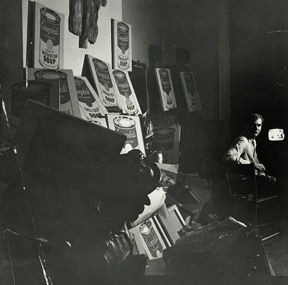 Andy Warhol at his 1342 Lexington Avenue studio with Campbell’s Soup Cans, 1962. Collection The Andy Warhol Museum, Pittsburgh
