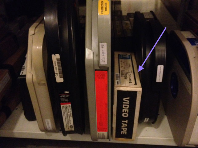 Photograph of one- and two-inch video tapes. The two-inch Quadraplex tape is indicated by the arrow.