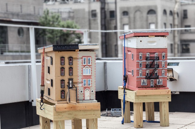 Two beehives, modeled like city buildings, are kept on a nearby rooftop in case additional honeybees are required during the exhibition of Untilled. Photo The Museum of Modern Art