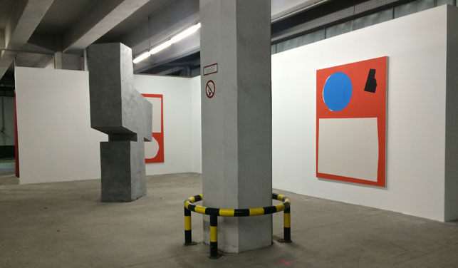 The exhibition Concrete Utopias, organized by the Realismus club, in a parking garage in Berlin. Photo: Hannah Felt Garner