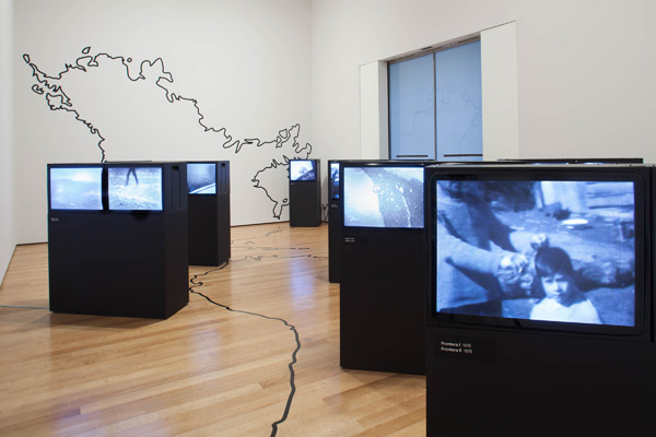 Juan Downey. Video Trans Americas. 1973–76. Fourteen-channel video (black and white, sound; duration variable) and vinyl map. The Museum of Modern Art, New York. Acquired through the generosity of the Latin American and Caribbean Fund and Baryn Futa in honor of Barbara London. © 2015 Estate of Juan Downey & Marilys B. Downey.  Installation view, Transmissions: Art in Eastern Europe and Latin America, 1960–1980, The Museum of Modern Art, New York, September 5, 2015–January 3, 2016. Photo: Thomas Griesel