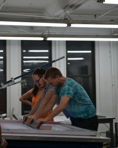 Erik Hougen and a studio assistant making prints