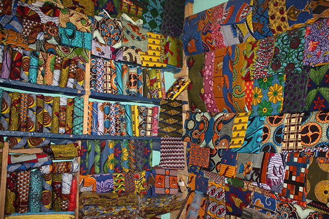 Waxprints sold in a shop in West Africa, 2009. Photo: Alexander Sarley. Used via Creative Commons license