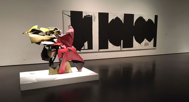 From left: John Chamberlain. Sweet William. 1962; Robert Motherwell. Elegy to the Spanish Republic, 100. 1963–75. Installation view, Los Angeles Country Museum of Art, Los Angeles. Photo: Isabel Ross
